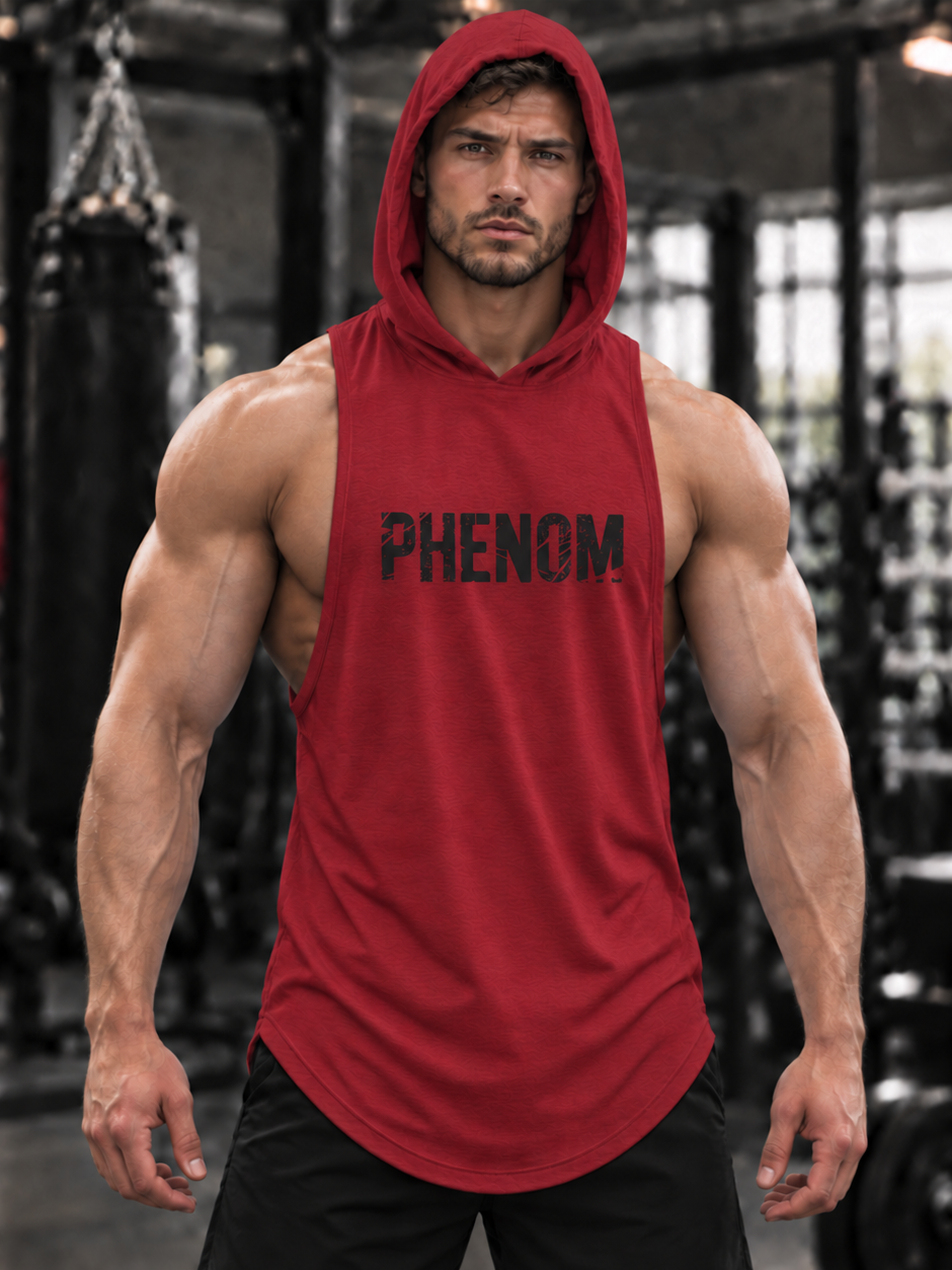 A muscular man wearing a red sleeveless hooded tank top with 'PHENOM FORGE' printed in black across the chest, standing in a gym with a blurred background.