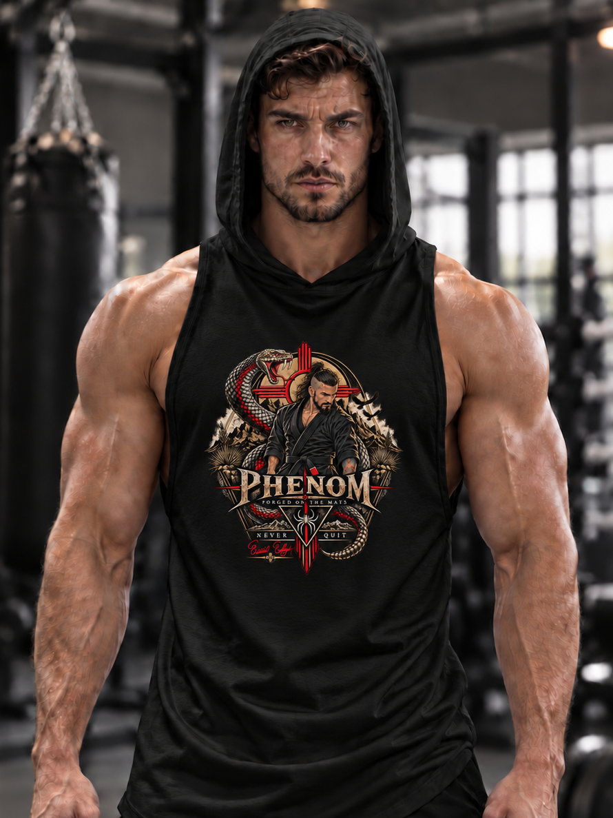 A muscular man in a black gym setting wearing a black sleeveless hooded tank top with a detailed red, gold, and white chest graphic that reads 'PHENOM'.