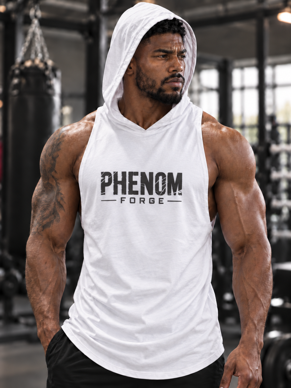 A muscular man in a gym wearing a white sleeveless hooded tank top with 'PHENOM FORGE' printed in black on the chest, paired with black athletic shorts.